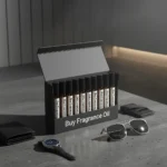 Men’s perfume oil discovery kit Set A – 10 small 2ml perfume vials displayed on a dark marble surface with amber lighting, evoking masculine elegance.