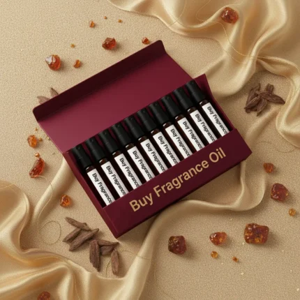 Oriental perfume oil discovery kit Set A – 10 × 2 ml glass vials of oud and amber perfume oils arranged on a warm golden surface with wood and resin details.