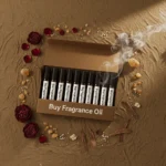 Oriental perfume oil discovery kit – 10 × 2 ml oud, amber, and musk vials arranged on a warm golden background with incense and resin accents.