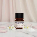 Experience Rose Jasmine Musk Perfume Oil, inspired by Lancôme Idôle (for reference only). A luminous floral blend of rose, jasmine, and soft white musk — pure, feminine, and refined. Alcohol-free, long-lasting perfume oil crafted for modern elegance and daily sophistication.
