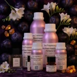 Black Plum Freesia Amber perfume oil bottle with dark plums, freesia flowers and glowing amber crystals under night lighting.