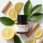 Citrus Green Sandal perfume oil bottle with fresh lemon, green leaves and smooth sandalwood in clean daylight setting.