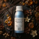 Vanilla Amber Tonka perfume oil bottle with golden amber resin, vanilla pods and tonka beans in dark masculine luxury setting.