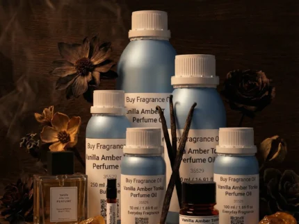 Vanilla Amber Tonka perfume oil bottle with golden amber resin, vanilla pods and tonka beans in dark masculine luxury setting.