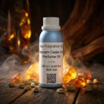 Cardamom Cedar Amber perfume oil bottle with dark amber tones, spicy cardamom warmth and elegant woody night atmosphere.