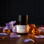 Iris Amber Cedar perfume oil bottle with iris flowers, amber tones and cedarwood elements in a dark elegant setting.