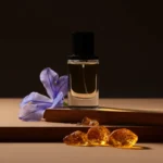 Iris Amber Cedar perfume oil bottle with iris flowers, amber tones and cedarwood elements in a dark elegant setting.