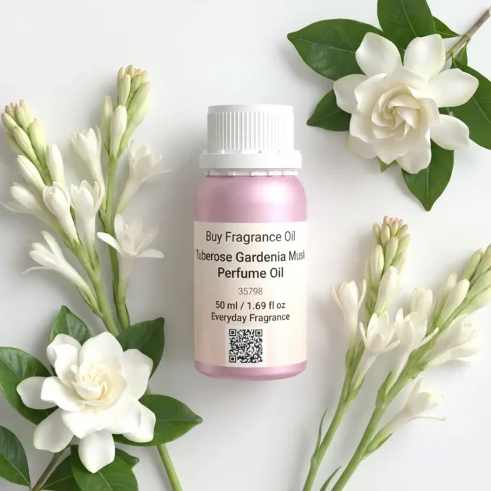 Tuberose Gardenia Musk perfume oil bottle surrounded by white tuberose and gardenia flowers in soft daylight elegance.