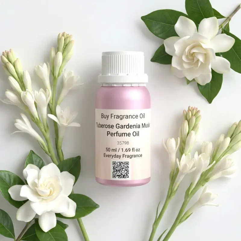 Tuberose Gardenia Musk perfume oil bottle surrounded by white tuberose and gardenia flowers in soft daylight elegance.