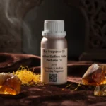 Leather saffron amber perfume oil with golden spice tones, smooth suede leather texture and warm resinous amber glow.