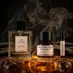 Oud amber saffron perfume oil with golden oriental glow, dark oud wood texture and warm resinous amber atmosphere.